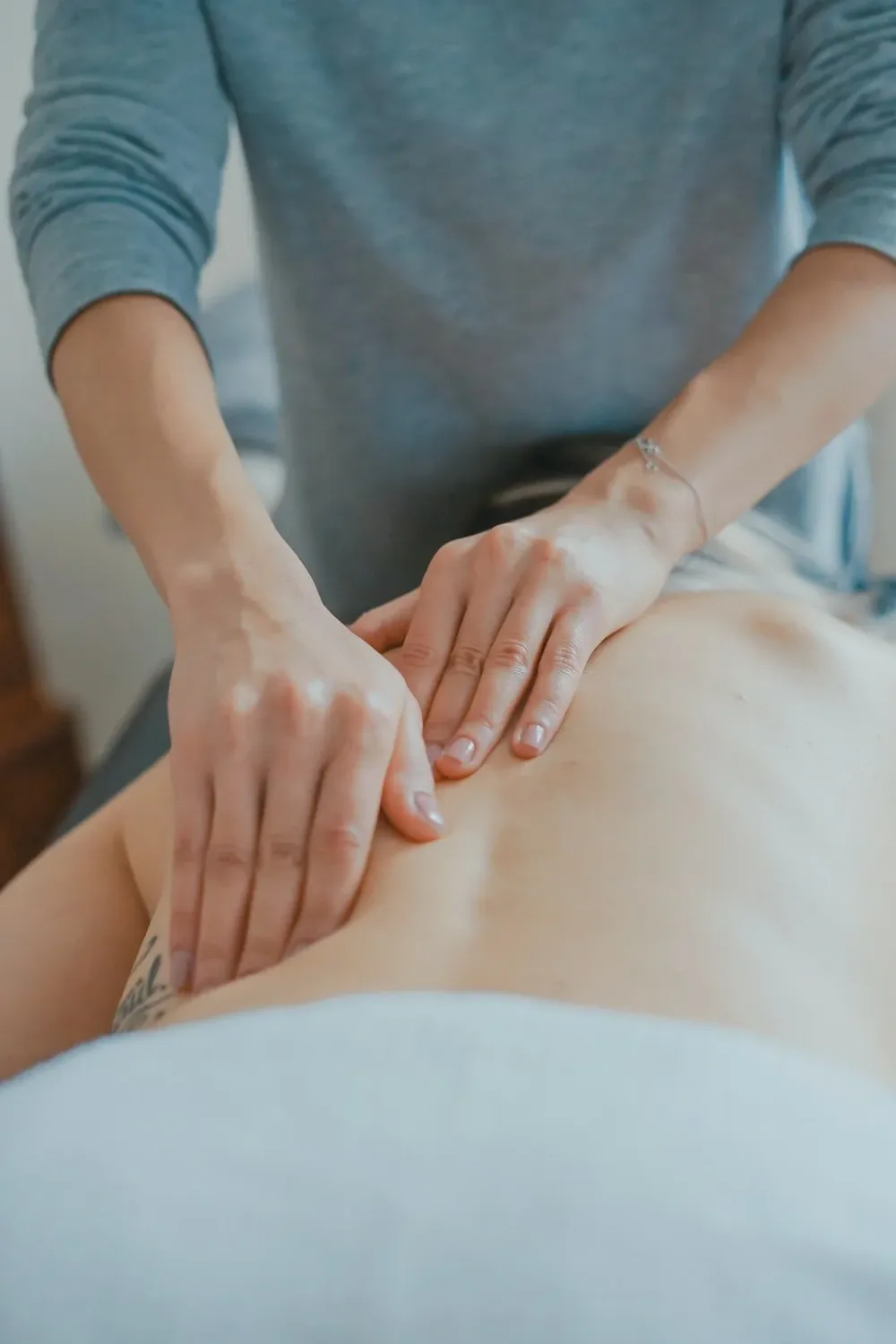 Manual therapy on patient's lower back