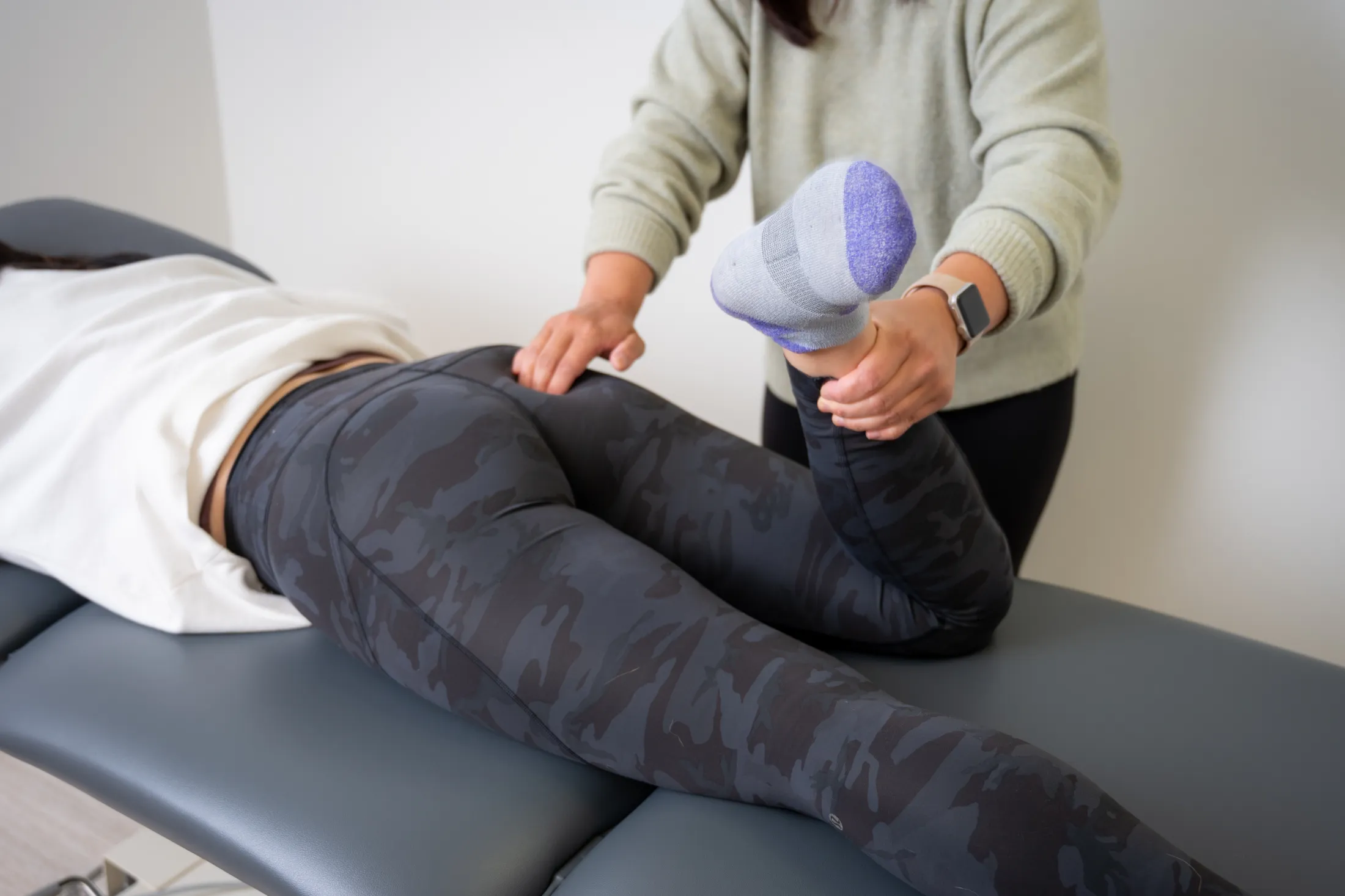 Dr. Meilin providing hands-on pelvic health manual therapy on the treatment table